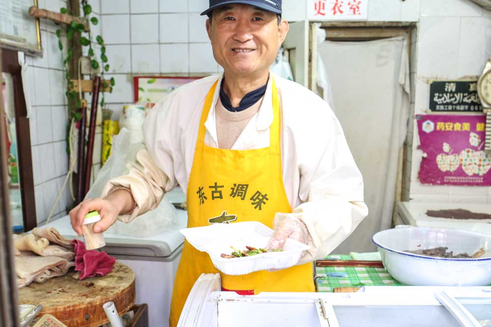 Person serving Mongol Beef