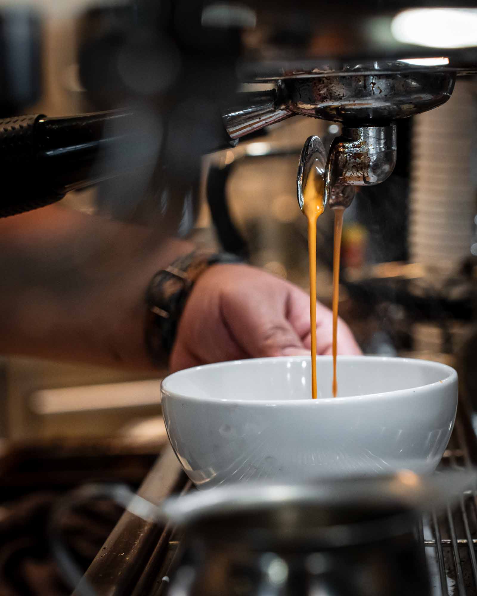 Espresso machine pouring espresso
