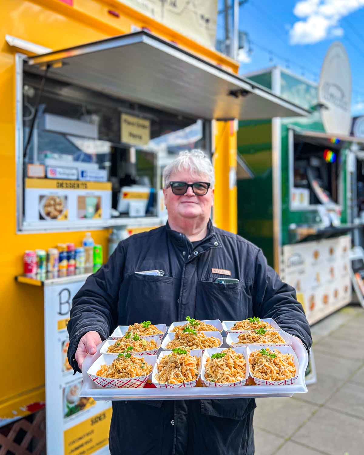 portland food cart tour guide holding food