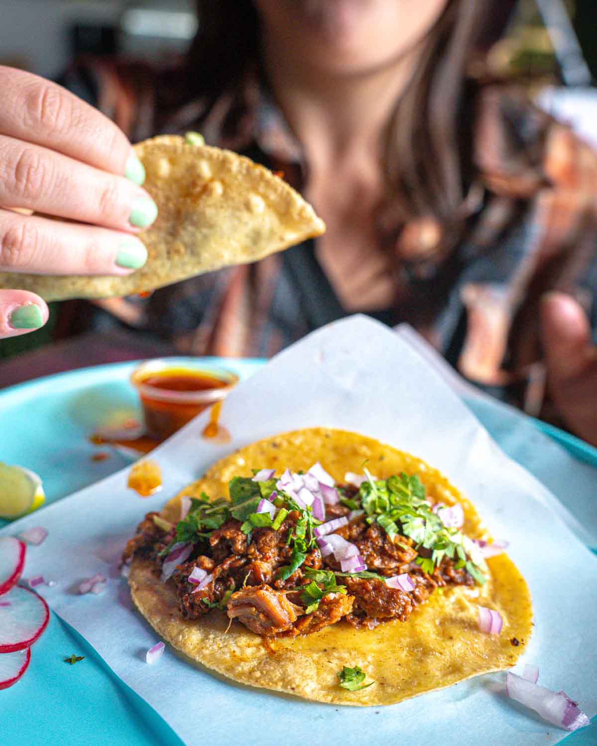 guest eating a beautiful taco
