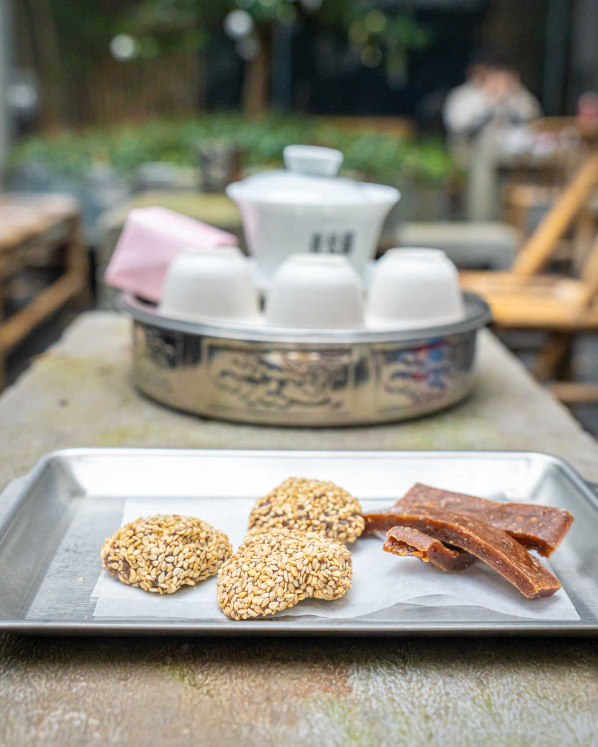 Traditional teapot and snacks at a trendy teahouse